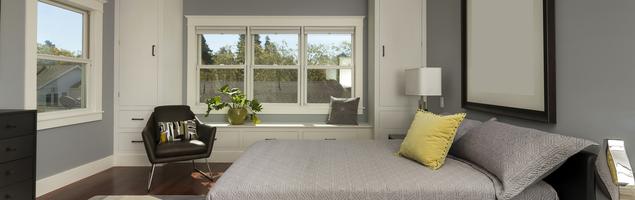 Szara sypialnia w stylu minimalistycznym – nowoczesne wnętrze